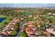 Stunning aerial view of the community, home and the nearby Spanish Trail Country Club golf course and water feature at 7627 Boca Raton Dr, Las Vegas, NV 89113