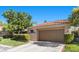 Lovely house with a well-kept lawn, mature trees, and an attached two-car garage at 7627 Boca Raton Dr, Las Vegas, NV 89113