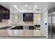 Spacious kitchen featuring stainless steel appliances, stone counters, and a breakfast bar at 7627 Boca Raton Dr, Las Vegas, NV 89113