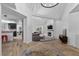 Bright living room featuring modern decor, a fireplace, and an open layout to the kitchen at 7627 Boca Raton Dr, Las Vegas, NV 89113