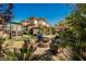 Wonderful backyard and outdoor entertaining area, play structure, and mature landscaping at 764 Ricota Ct, Henderson, NV 89012