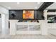 Chic bar area with stone accent wall, marble countertop, and custom lighting for entertaining at 764 Ricota Ct, Henderson, NV 89012