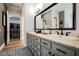 Bathroom features dual sinks with marble countertops, stylish fixtures, and a walk-in closet at 764 Ricota Ct, Henderson, NV 89012