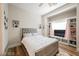 Cozy bedroom with plush carpeting, built-in shelving, and a large window at 764 Ricota Ct, Henderson, NV 89012