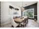 Traditional dining room with a large wooden table, neutral chairs, and natural light at 764 Ricota Ct, Henderson, NV 89012