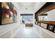 Bright foyer with a view into a living room with a piano, plus modern artwork on the walls at 764 Ricota Ct, Henderson, NV 89012