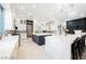 Gourmet kitchen featuring white cabinetry, double islands, stainless appliances, and modern lighting at 764 Ricota Ct, Henderson, NV 89012