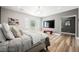 Spacious main bedroom boasts natural light, a large TV, and modern decor at 764 Ricota Ct, Henderson, NV 89012