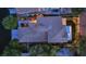 Aerial rooftop view showcasing a well-maintained tile roof, lush landscaping, and neighborhood surroundings at dusk at 7837 Sea Rock Rd, Las Vegas, NV 89128