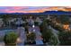Aerial view of property in a residential area with mountains in the background during sunset at 7837 Sea Rock Rd, Las Vegas, NV 89128