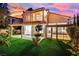 Charming backyard with a covered patio, well-kept lawn, and mature landscaping, ideal for outdoor entertaining at 7837 Sea Rock Rd, Las Vegas, NV 89128