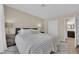 Comfortable bedroom features a large bed, stylish nightstands, and a connecting bathroom at 7837 Sea Rock Rd, Las Vegas, NV 89128
