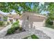 Beautiful home with lush landscaping, a well-maintained lawn, and a two-car garage at 7837 Sea Rock Rd, Las Vegas, NV 89128