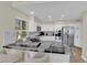Modern kitchen featuring white cabinets, stainless steel appliances and granite countertops at 7837 Sea Rock Rd, Las Vegas, NV 89128