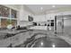 Beautiful kitchen featuring white cabinets, stainless steel appliances, and granite countertops at 7837 Sea Rock Rd, Las Vegas, NV 89128