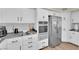 Spacious kitchen equipped with stainless steel appliances and sleek white cabinetry at 7837 Sea Rock Rd, Las Vegas, NV 89128