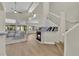 Open living room with high ceilings, fireplace, and large windows for natural light at 7837 Sea Rock Rd, Las Vegas, NV 89128