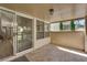 Covered patio featuring stone floors with a view of the bright, open interior at 7837 Sea Rock Rd, Las Vegas, NV 89128