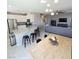 Bright open floorplan with modern kitchen featuring stainless appliances and a kitchen island at 7990 Formitch Ct, Las Vegas, NV 89166