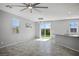 Open concept living room with access to backyard, tile floors, and recessed lighting at 7990 Formitch Ct, Las Vegas, NV 89166