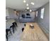 Spacious open floorplan with dining area, kitchen island, and comfortable living area at 7990 Formitch Ct, Las Vegas, NV 89166