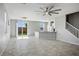 Bright, open-concept living room with tile floors, and easy access to the kitchen and backyard at 7990 Formitch Ct, Las Vegas, NV 89166