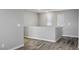 Open loft area with modern flooring, large windows, and neutral gray paint at 7990 Formitch Ct, Las Vegas, NV 89166