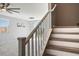 View of the staircase leading to the second floor, modern light fixture, and view to backyard at 7990 Formitch Ct, Las Vegas, NV 89166