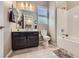 Bathroom showcasing a modern vanity, a mirror, a toilet, and a shower-tub combo at 800 Rosewater Dr, Henderson, NV 89011