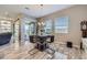 Dining area with sleek furniture and a modern chandelier, bathed in natural light at 800 Rosewater Dr, Henderson, NV 89011