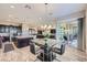Open dining area with modern table set and seamless flow from kitchen and living room at 800 Rosewater Dr, Henderson, NV 89011