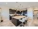 Eat-in kitchen featuring an oversized island, stainless appliances, and ample cabinet space at 800 Rosewater Dr, Henderson, NV 89011