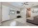 Comfortable living room with tile flooring, a TV, a ceiling fan, and lots of natural light at 800 Rosewater Dr, Henderson, NV 89011