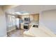 Well-lit kitchen featuring stainless steel appliances, light wood cabinets, and a marble countertop breakfast bar at 8070 W Russell Rd # 1046, Las Vegas, NV 89113