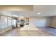 Open concept kitchen featuring marble countertop breakfast bar, stainless steel appliances and stylish wood flooring at 8070 W Russell Rd # 1046, Las Vegas, NV 89113