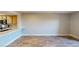 Spacious, unfurnished living space adjacent to the kitchen featuring light wood floors ready to be personalized at 8070 W Russell Rd # 1046, Las Vegas, NV 89113