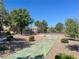 Community shuffleboard court with nearby tennis courts and mature landscaping at 8070 W Russell Rd # 1046, Las Vegas, NV 89113