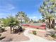 An aerial perspective of a community tennis court with well maintained landscaping at 8070 W Russell Rd # 1046, Las Vegas, NV 89113
