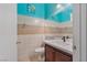 Well-lit half-bathroom features decorative tile and a modern vanity at 8509 W Rochelle Ave, Las Vegas, NV 89147