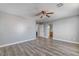 Spacious bedroom featuring wood-look flooring, neutral walls, and multiple access points at 8509 W Rochelle Ave, Las Vegas, NV 89147