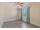 Well-lit bedroom featuring wood laminate flooring, neutral walls, and a ceiling fan at 8509 W Rochelle Ave, Las Vegas, NV 89147