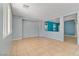Bright living room with tile flooring and a half wall overlooking another room at 8509 W Rochelle Ave, Las Vegas, NV 89147