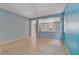 Open-concept living room with tile flooring and half-wall to the other room at 8509 W Rochelle Ave, Las Vegas, NV 89147
