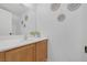 A clean bathroom features a large mirror, modern sink and vanity, and decorative wall art at 8639 Horizon Wind Ave # 102, Las Vegas, NV 89178