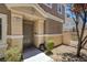 Inviting entrance with decorative door and landscaping, leading to a charming townhome at 8639 Horizon Wind Ave # 102, Las Vegas, NV 89178