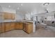 Open concept kitchen with light wood cabinets, and stainless steel appliances at 8639 Horizon Wind Ave # 102, Las Vegas, NV 89178