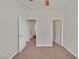 Bright bedroom features neutral walls, carpet flooring, and an open doorway at 9044 Blue Raven Ave # R, Las Vegas, NV 89143