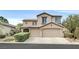 Charming two-story home with a three-car garage and well-manicured landscaping at 9044 Blue Raven Ave # R, Las Vegas, NV 89143