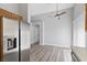 Spacious dining area with stainless steel refrigerator and easy access to the rest of the house at 9644 Flying Eagle Ln, Las Vegas, NV 89123