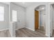 Inviting entryway showcasing wood-look floors, neutral walls, and convenient storage at 9644 Flying Eagle Ln, Las Vegas, NV 89123